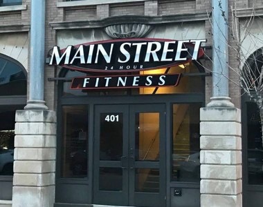 Street-level entrance beneath the Main Street 24 Hour Fitness sign.