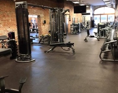 Weight machines and a cable station on the main floor.